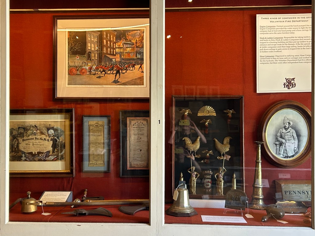 A display case containing S F F D memorabilia from the previous century.